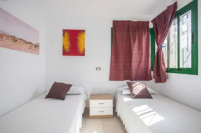 Cama o camas de una habitación en GuestReady - Las Palomas 48