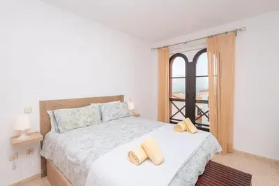 Cama o camas de una habitación en Ático con terraza en Agaete