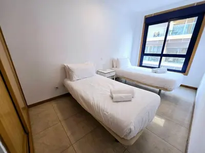 Cama o camas de una habitación en VV Dúplex Playa de Las Canteras 