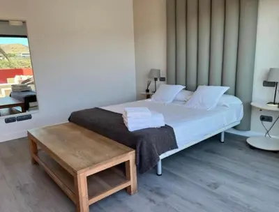 Cama o camas de una habitación en VILLA Cooper l HEATED Pool l PVT Garden I GOLF I SEA VIEWS