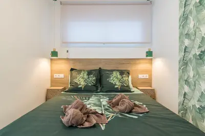 Cama o camas de una habitación en Home2Book Stylish Tropical Apt Terrace & Pool