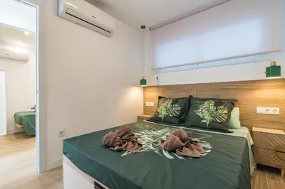 Cama o camas de una habitación en Home2Book Stylish Tropical Apt Terrace & Pool