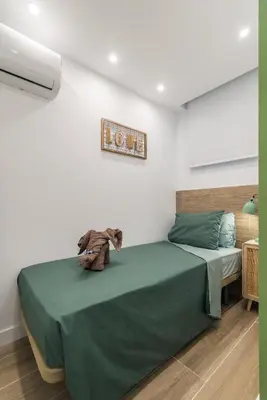 Cama o camas de una habitación en Home2Book Stylish Tropical Apt Terrace & Pool