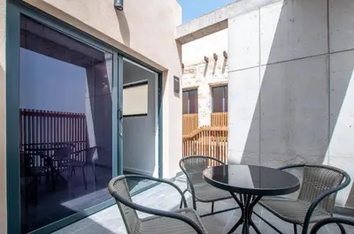 Un balcón o terraza de La Casa de San Juan - DORAMAS
