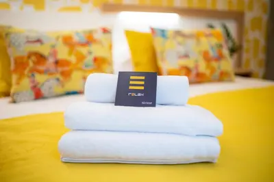 Cama o camas de una habitación en Eleven Boutique Apartments by Airnest