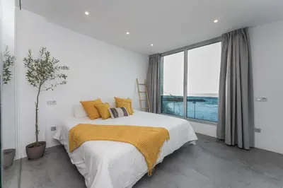 Cama o camas de una habitación en Gold Suite Canteras by Canarias Homelidays