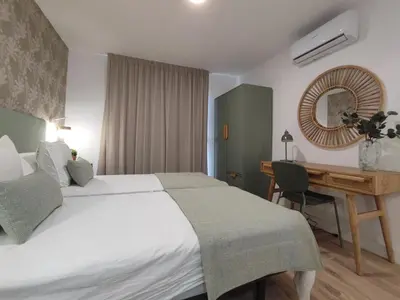 Cama o camas de una habitación en Bungalow con jardín privado junto al Yumbo