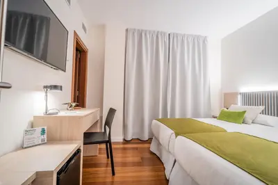 Cama o camas de una habitación en SAHERA HOTEL Boutique