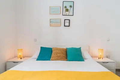 Cama o camas de una habitación en Home2Book Las Canteras Beach House