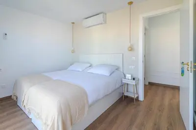 Cama o camas de una habitación en Luxury Beach Terrace Loft