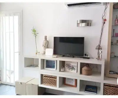 Una televisión o centro de entretenimiento en Apartamento Playa relax