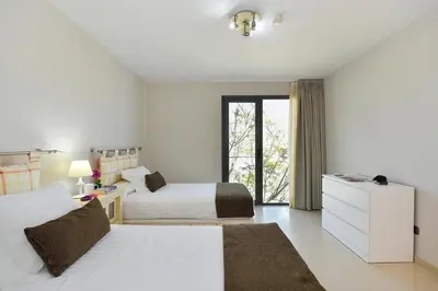 Cama o camas de una habitación en Los Lagos 36 by VillaGranCanaria