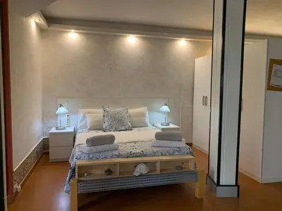 Cama o camas de una habitación en jardin vista mar