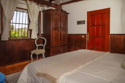 Cama o camas de una habitación en CASA RÚSTICA CON JACUZZI