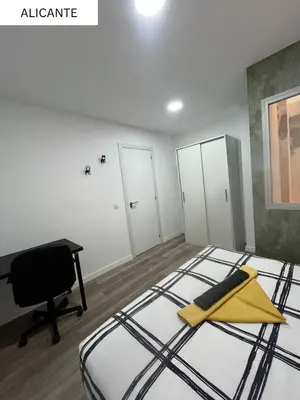 Cama o camas de una habitación en CoLiving El Juanito