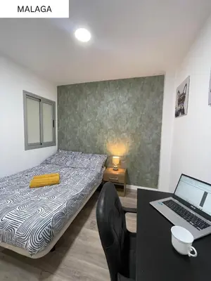 Cama o camas de una habitación en CoLiving El Juanito