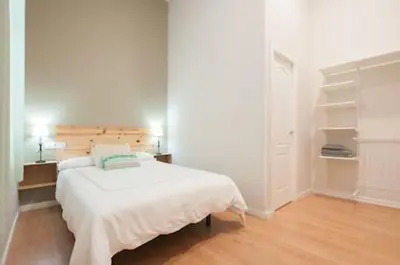 Cama o camas de una habitación en Triana 103 Rooms & Suites