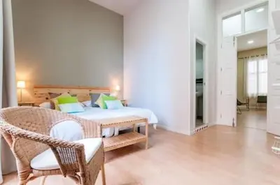 Cama o camas de una habitación en Triana 103 Rooms & Suites