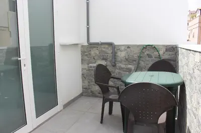 Un patio o zona al aire libre en VV Alcaravaneras Ático A