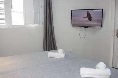 Cama o camas de una habitación en VV Alcaravaneras Ático B