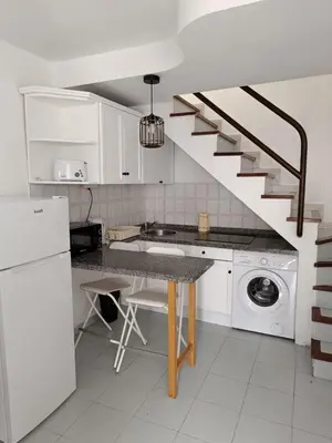 Una cocina o zona de cocina en Aloha Playmar Duplex