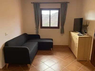 Una televisión o centro de entretenimiento en Finca Los Dioses III