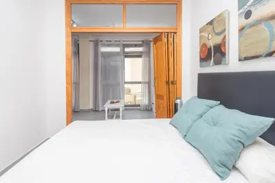 Cama o camas de una habitación en Las Canteras Cozy Apt - 2 min walk to beach