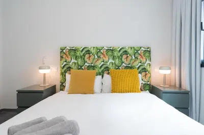 Cama o camas de una habitación en Macaronesia LPA Suites