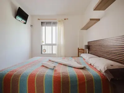 Cama o camas de una habitación en Apartamento Colón by Villas Rivero