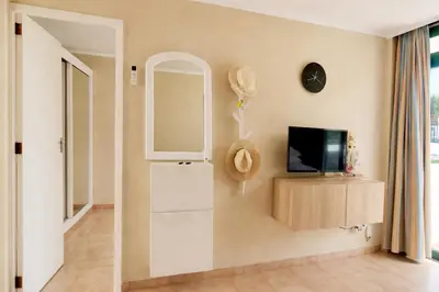 Una televisión o centro de entretenimiento en Apartment Atis Caracol