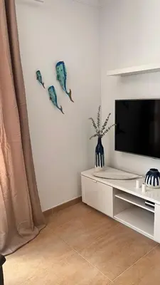 Una televisión o centro de entretenimiento en VV Janoa Playa Las Canteras 1