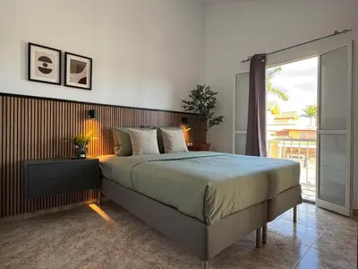 Cama o camas de una habitación en Green Oasis Paradise