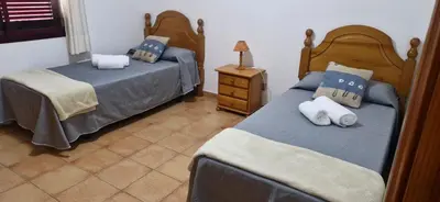 Cama o camas de una habitación en Primera línea de playa, apartamento completo