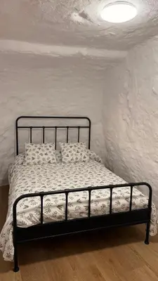 Cama o camas de una habitación en Cueva Las Nubes