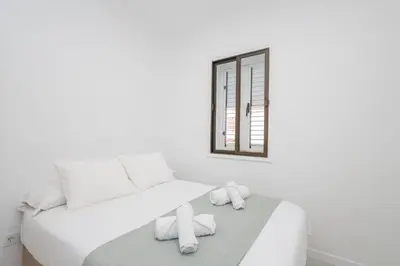 Cama o camas de una habitación en Confital 2BR Cozy Flat