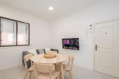 Una televisión o centro de entretenimiento en Confital 2BR Cozy Flat