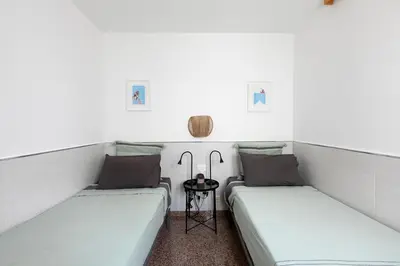 Cama o camas de una habitación en Flor del Arcoíris