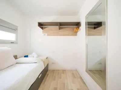 Cama o camas de una habitación en Beyond Amadores 11