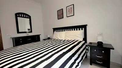 Cama o camas de una habitación en Casa MOLINA con TERRAZA al lado de la playa
