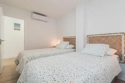 Cama o camas de una habitación en Home2Book Chic Attic City&Beach Views Las Palmas