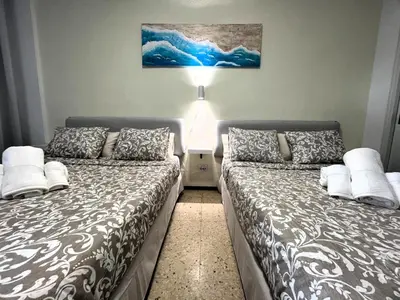 Cama o camas de una habitación en Sunny Garden&Playa Apartment - Playa Del Inglés