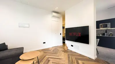Una televisión o centro de entretenimiento en Gran Canaria Beach Folks