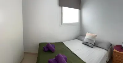 Cama o camas de una habitación en Apartamento BRISA DEL MAR Arguineguín