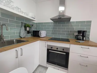 Una cocina o zona de cocina en Nice cozy apartment near the dunes