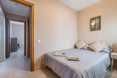 Cama o camas de una habitación en Spacious Two Bedroom Apartment with Terrace right on the Surf Beach