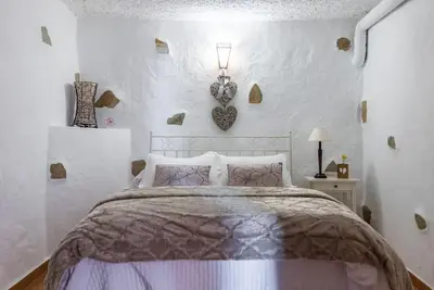 Cama o camas de una habitación en Casa Cueva Rural los Pastores