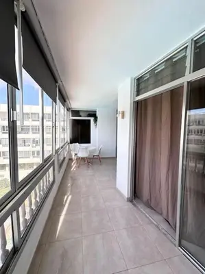 Una televisión o centro de entretenimiento en Apartamento Playa Cañon del águila
