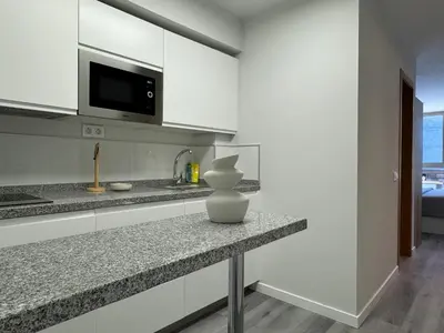 Una cocina o zona de cocina en Danubio Estudios 107