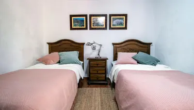 Cama o camas de una habitación en Casas rurales de Guayadeque