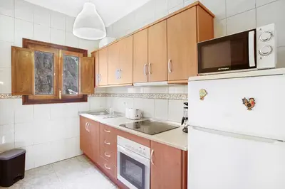 Una cocina o zona de cocina en casa La cabaña Villa Palomino